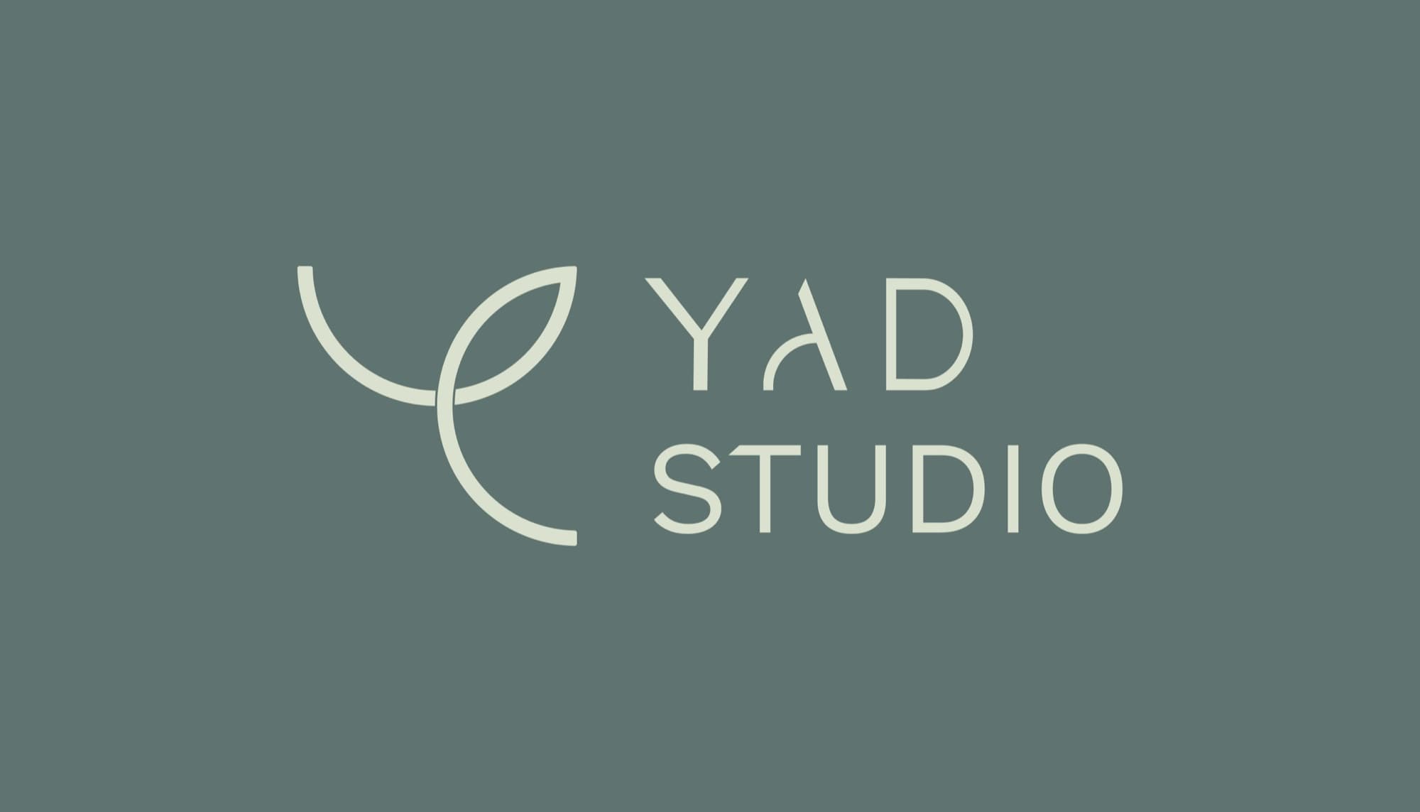 YAD Studio leaf logomark and logotype on a sage ground.